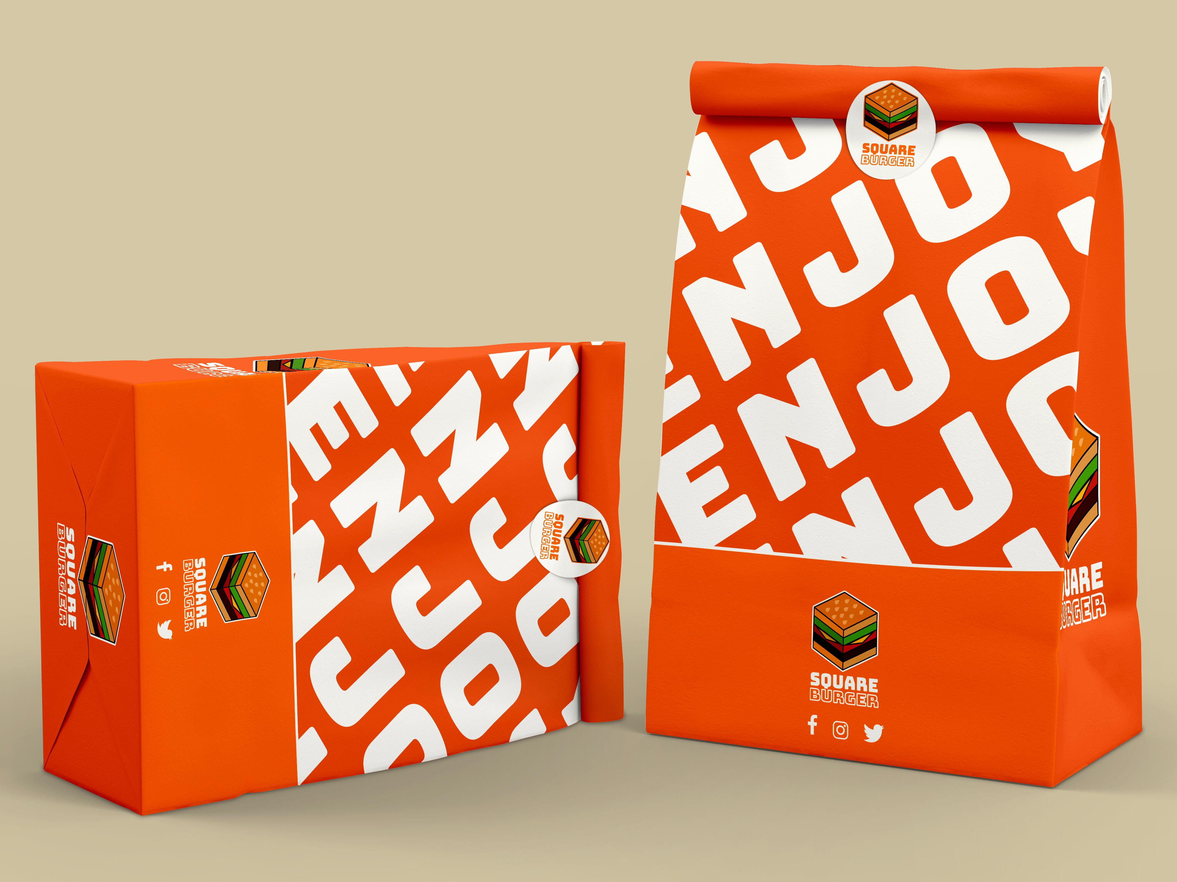 2 takeaway bags displaing the branding. 'Enjoy' is written large across the front of each bag.