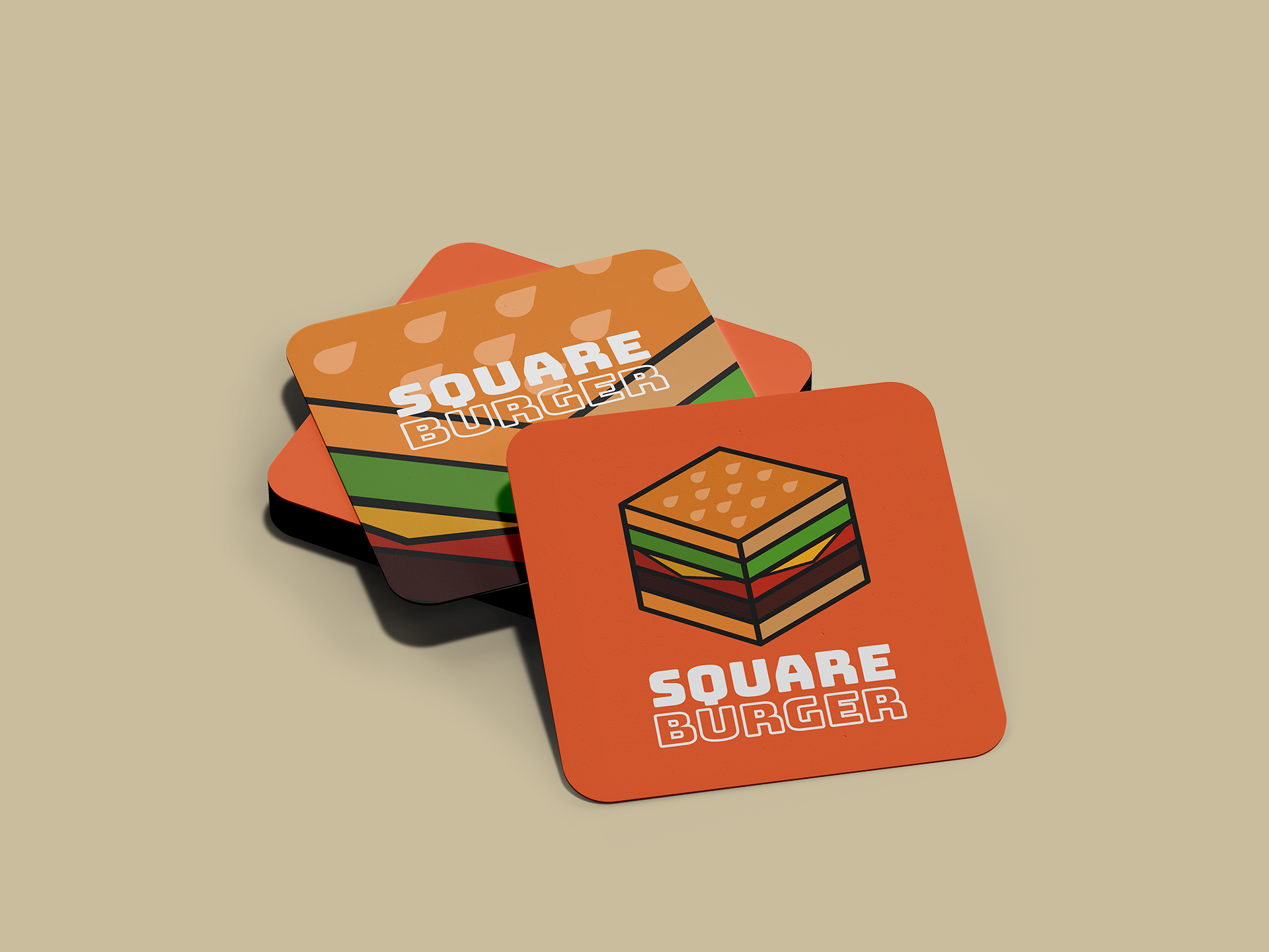 A pile of drinks coasters displaying the Square Burger branding.