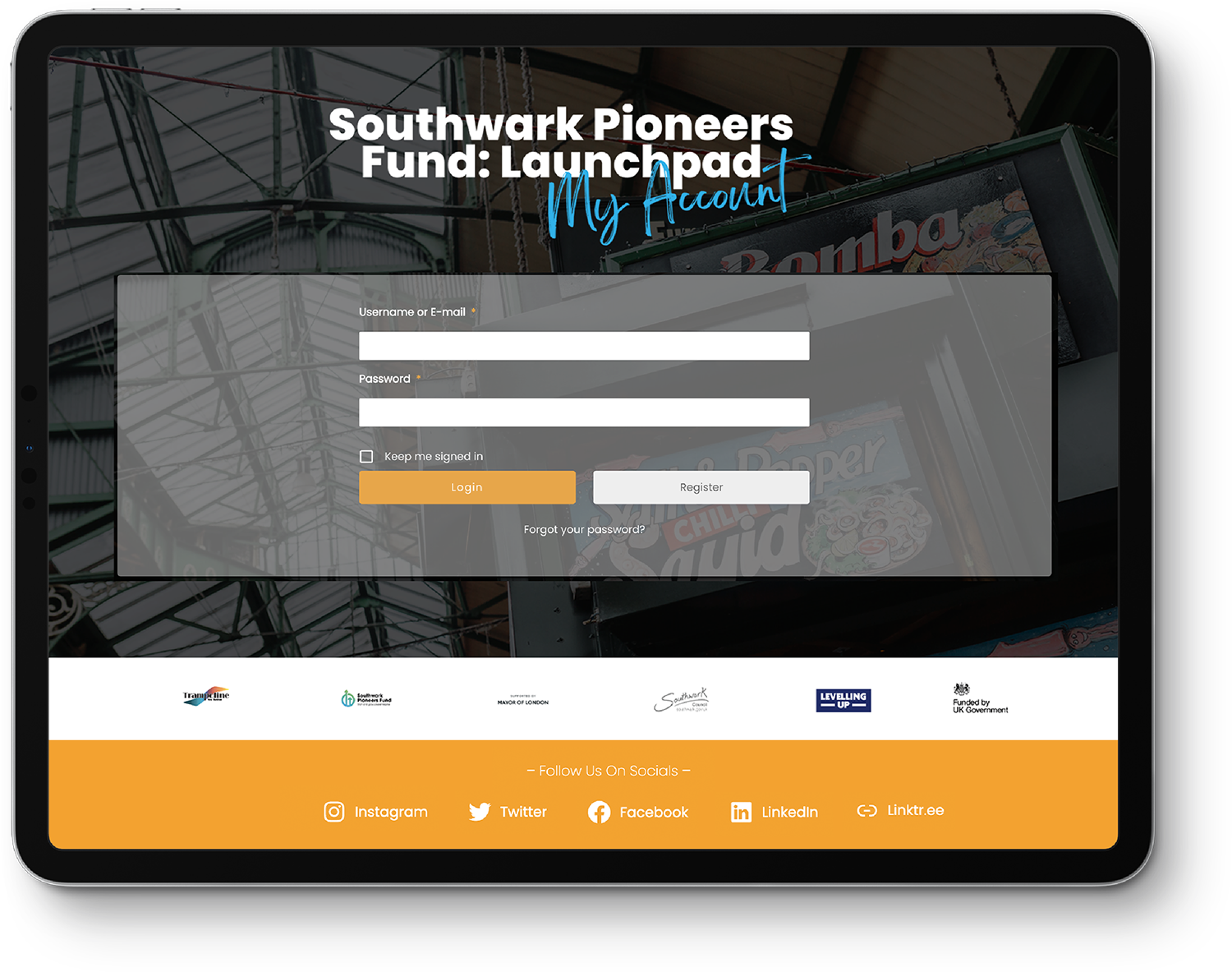 An iPad displaying the login page for the Launchpad account portal.
